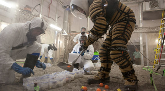 The spacesuits astronauts will wear while exploring the surface of Mars will protect the person inside, supply air and water, and be flexible enough that astronauts can dig samples and do the other tasks required. (NASA.gov image)