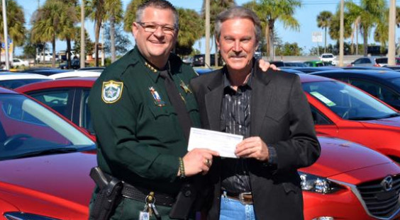 This past week A.J. Hiers of Boniface Hiers officially presented our agency with a check in excess of $3,000 that covered the cost of animal adoptions during the month of December 2015 at our Brevard County Sheriff's Office Animal Care Centers. (BCSO image)