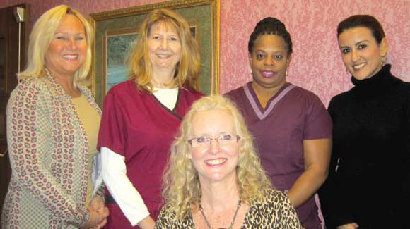 SOLARIS HEALTHCARE is known for its tenured staff. Standing from left to right is Mary Matta, Case Manager; Rita Spencer, Director of Nursing; Juanita Webb, CNA; and Pam Cepeda, MSW. Seated is Sandy Lengyel, Admissions Director.