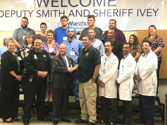 Wuesthoff Health System CEO Steve Patonai helps welcome back Agent Casey Smith, along with some of the medical team that August night. (Zach Clark, Space Coast Daily Image)