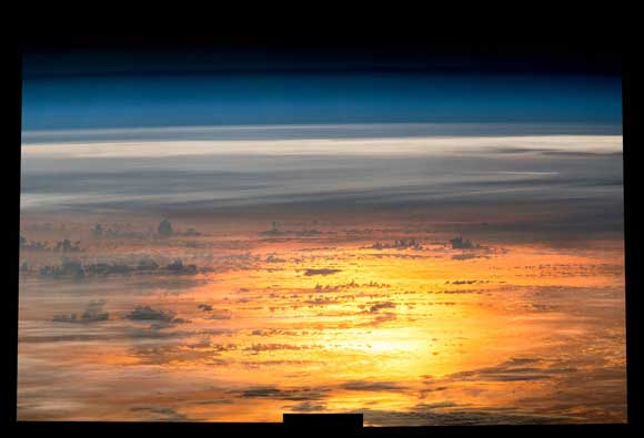 PHOTO OF THE DAY: Expedition 47 Flight Engineer Jeff Williams of NASA captured a series of photos on April 25, 2016, for this composite image of the setting sun reflected by the ocean. (NASA image)