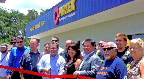 Dan & Karin Ferretti (center) surrounded by their employees at PIRTEK ribbon cutting