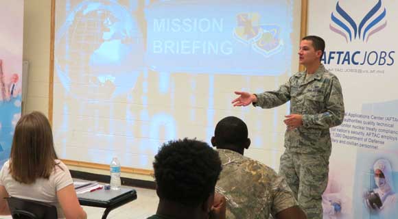 First Lt. David Donndelinger, a tech room manager with the Air Force Technical Applications Center, Patrick AFB, Fla., delivers his organization’s mission briefing to students attending STEMversity. (U.S. Air Force photo by Rose Day)