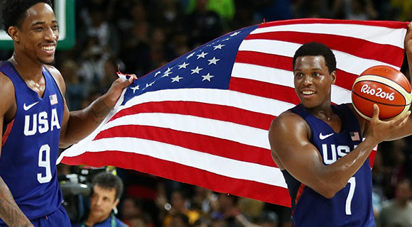 Toronto Raptors teammates, DeMar DeRozan and Kyle Lowry celebrate after defeating Serbia in the men's gold-medal game at the Rio 2016 Olympic Games. (Team USA Image)