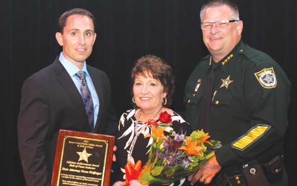 The late legendary State Attorney Norman Wolfinger was inducted in the Space Coast Public Service Hall of Fame. Above, Wolfinger's family accept his award from Sheriff Wayne Ivey during the first annual Space Coast Public Service Awards & Hall of Fame Induction Gala at the King Center on September 24. The Space Coast Daily Awards Committee reviewed an incredible list of nominations and recognized more than 100 extraordinary Space Coast Public Servants during this very special event. (Steve Wilson image)