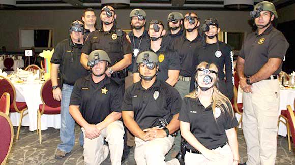 Titusville Police Officers participated in the “Dining in the Dark” event by serving over 100 guests dinner in complete darkness with just the aid of wearing their night vision goggles. (TPD image)