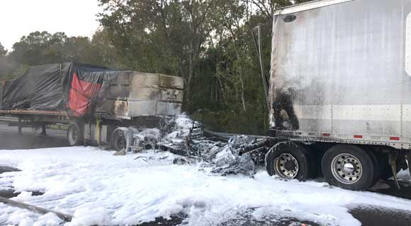 Brevard County Fire Rescue reported a crash on Saturday morning as two tractor trailers collided, causing one to catch fire. (BCFR image)