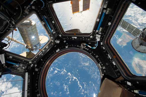 Orbital ATK's Cygnus cargo craft is seen from the Cupola module windows aboard the International Space Station on Oct. 23, 2016. (NASA image)