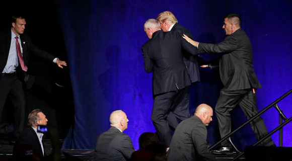 Republican Presidential candidate is suddenly rushed off the stage at his rally in Reno, Nevada (CBS image)