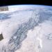 IMAGE OF THE DAY: Rocky Mountains Rise Above the Clouds From Orbit of ISS