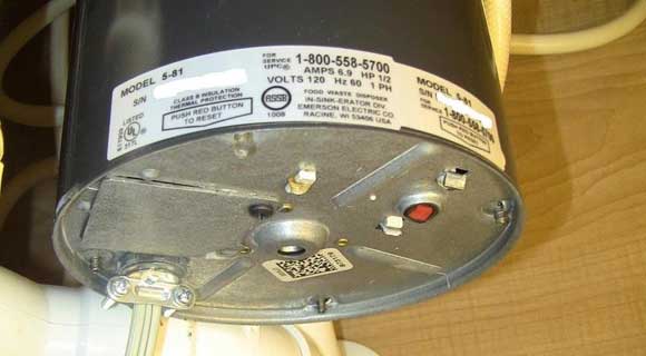 how to remove a garbage disposal stuck drain flange