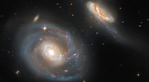 IMAGE OF THE DAY: NASA's Hubble Space Telescope Showcases Pair of ...