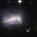 NASA Hubble Telescope Views a Galaxy Under Pressure 52 Million Light-Years from Earth